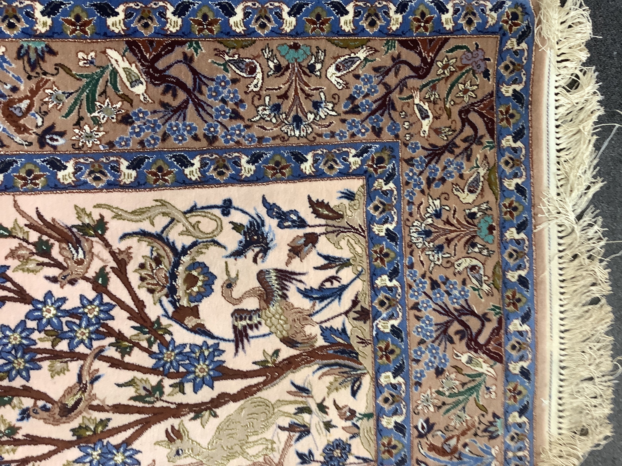 A Tabriz peach ground part silk pictorial rug, 180 x 111cm